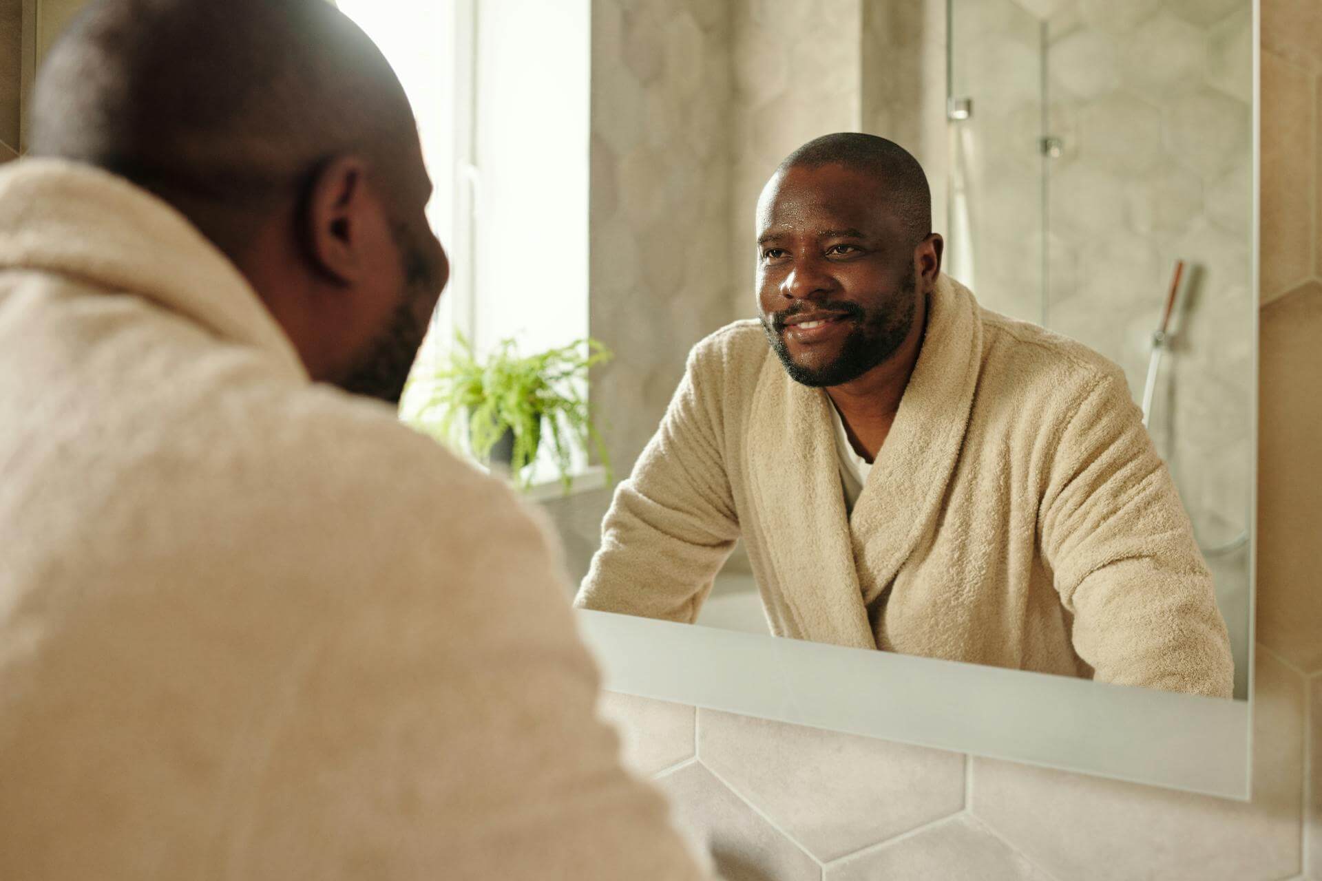 Calm and smiling man building good habits