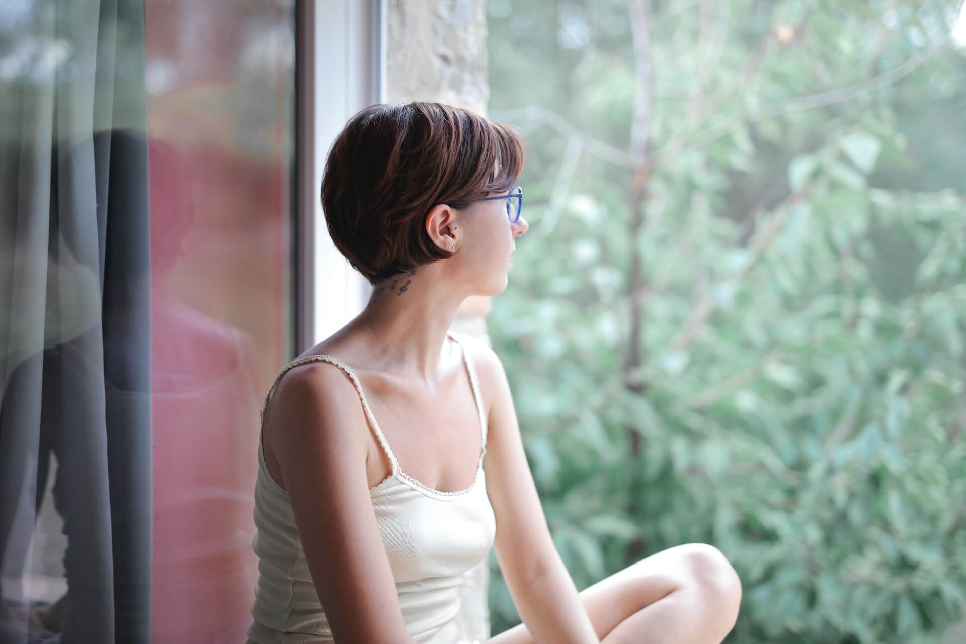 calm person looking out the window