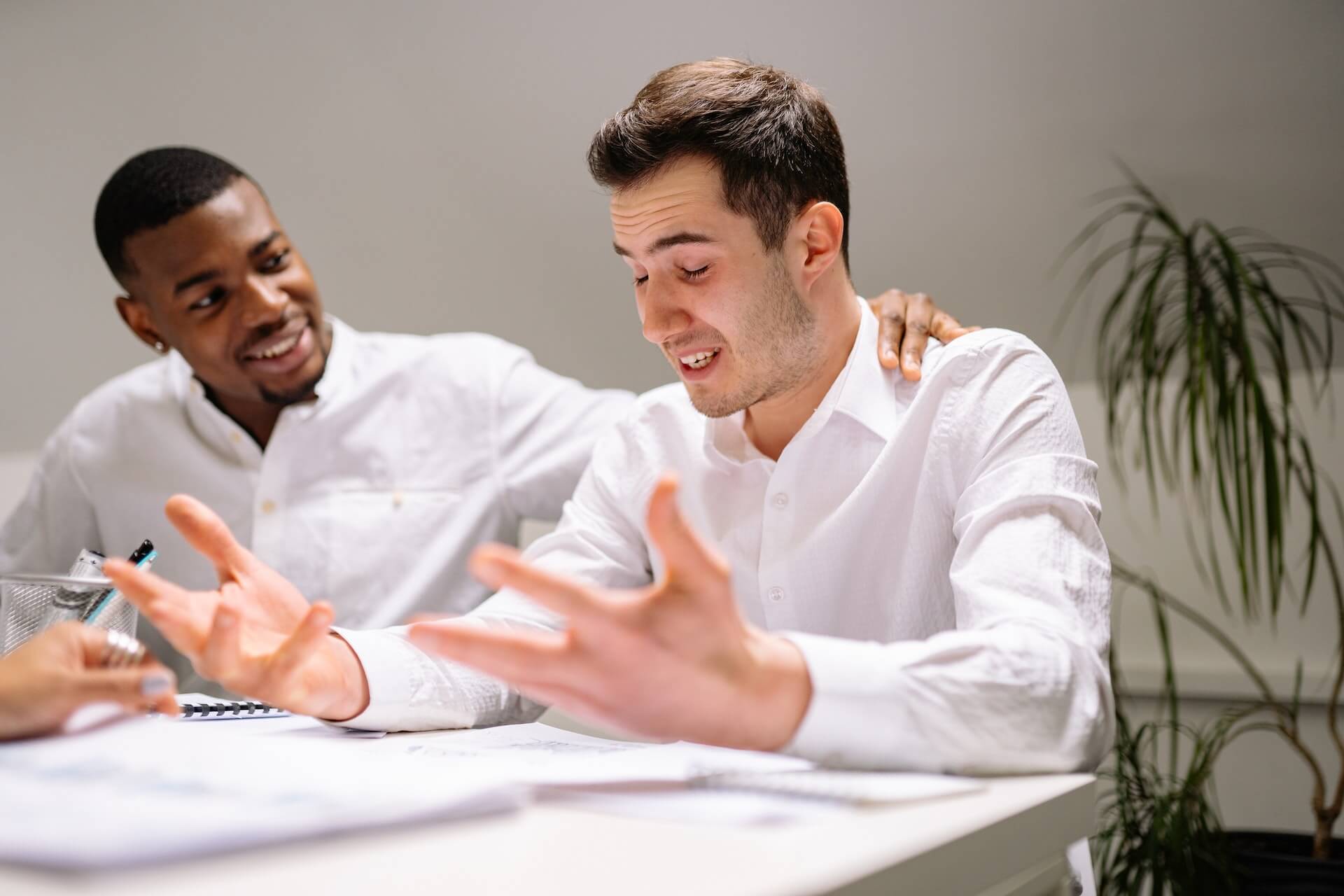 Person under stress receiving help